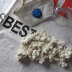 Close,Up,Of,Asbestos,Waste,Bag,With,Asbestos,,Face,Mask