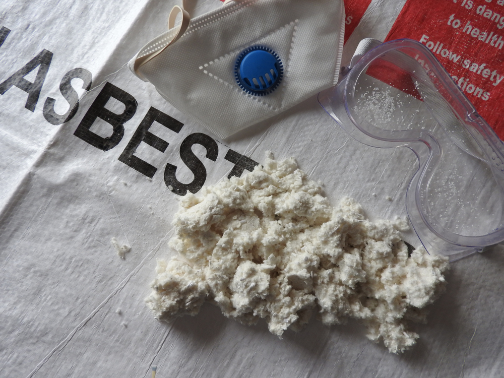 Close,Up,Of,Asbestos,Waste,Bag,With,Asbestos,,Face,Mask