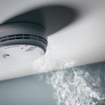 Smoke,Detector,And,Interlinked,Fire,Alarm,In,Action,Background,With